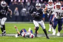 Raiders defensive end Chandler Jones (55) breaks away from a tackle attempt by New England Patr ...