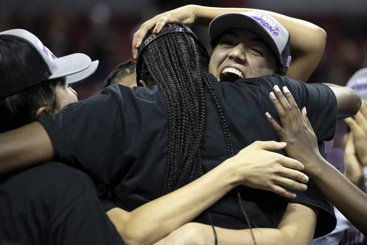 The UNLV Lady Rebels surround tournament MVP Desi-Rae Young after they won the Mountain West ch ...