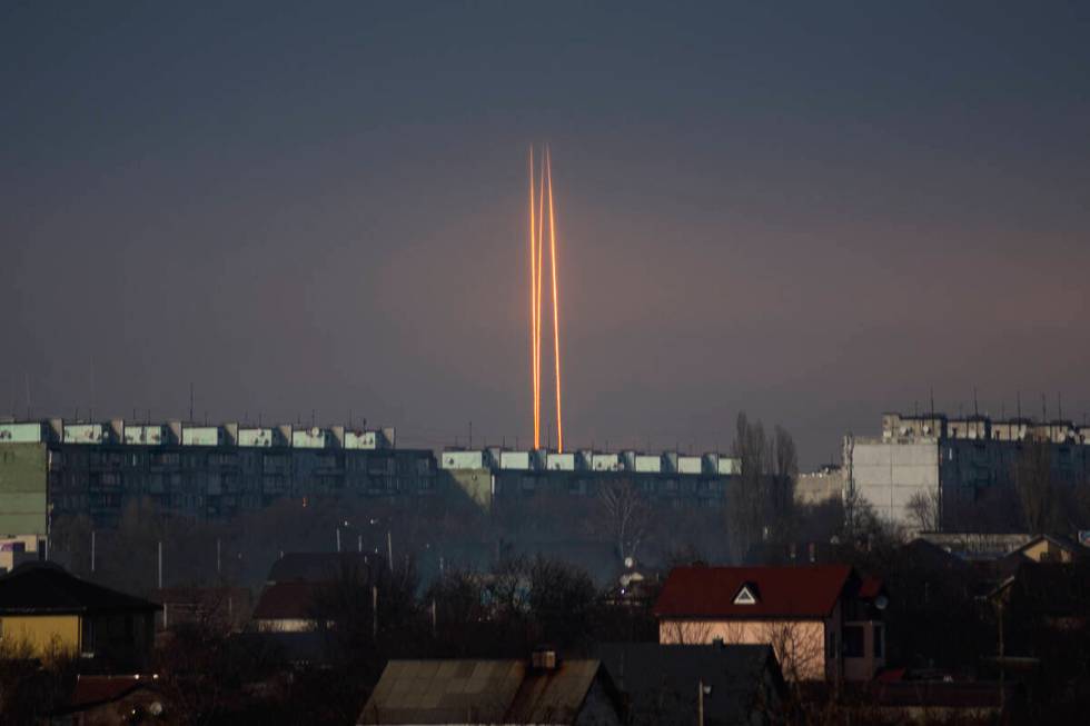 Three Russian rockets launched against Ukraine from Russia's Belgorod region are seen at dawn i ...