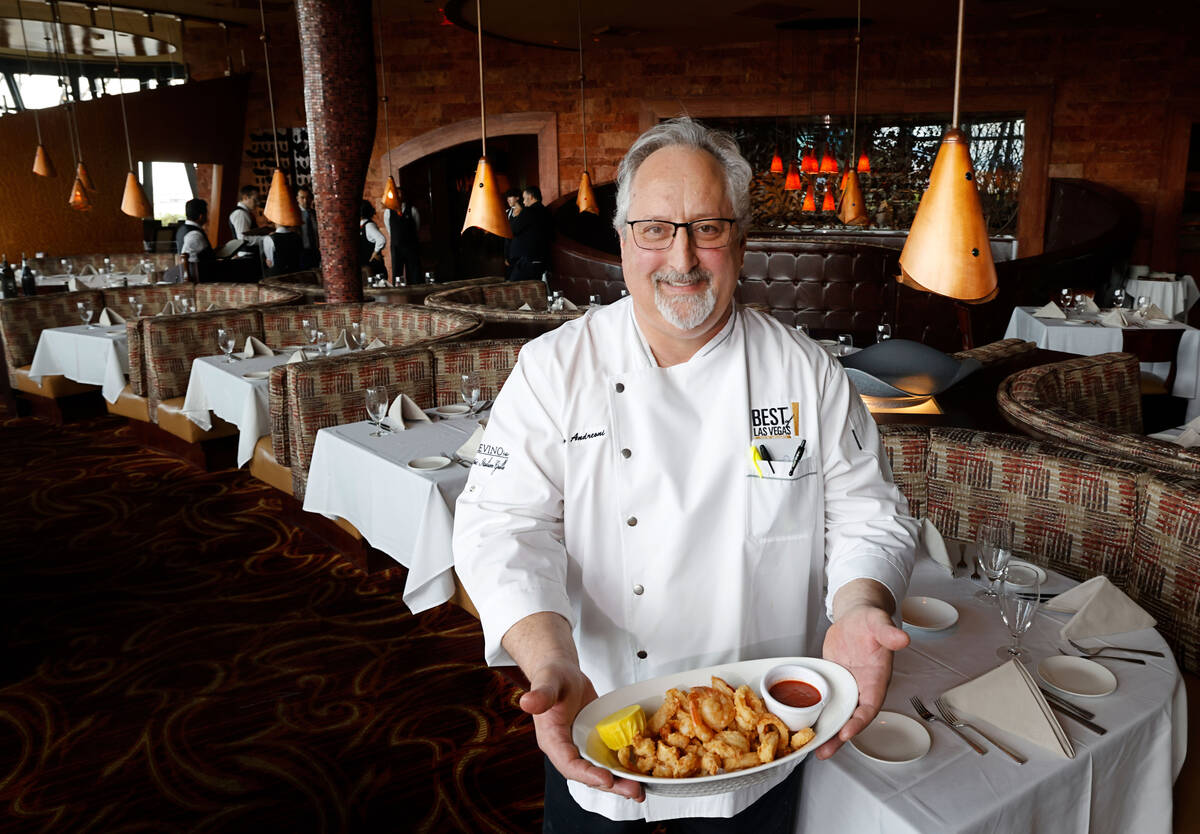 Panevino Executive Chef Mario Andreoni holds a dish of “Fried Calamari & Shrimp Antonio,” ...