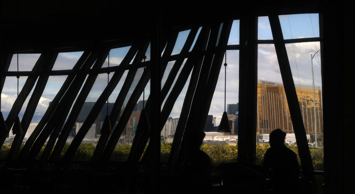 The Las Vegas Strip skyline is reflected in a glass at the Panevino restaurant, Wednesday, Marc ...