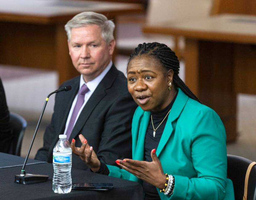 Belinda Harris, a North Las Vegas judge, speaks as Darin Imlay, a public defense attorney, look ...