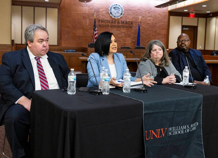 Chris Arabia, left, the Nevada State Public defender, JoNell Thomas, second right, the Clark Co ...