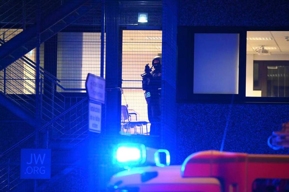 Armed police officers near the scene of a shooting in Hamburg, Germany, on Thursday, March 9, 2 ...