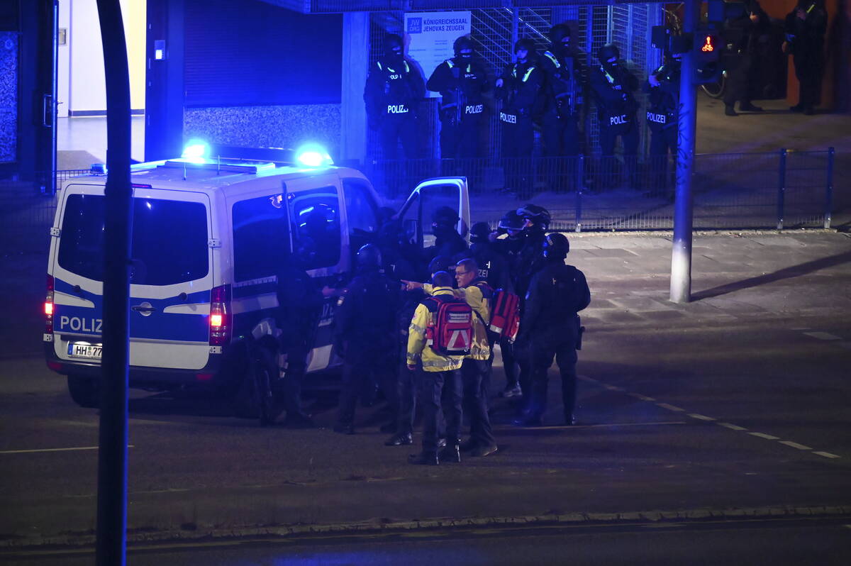 Armed police officers near the scene of a shooting in Hamburg, Germany, on Thursday, March 9, 2 ...