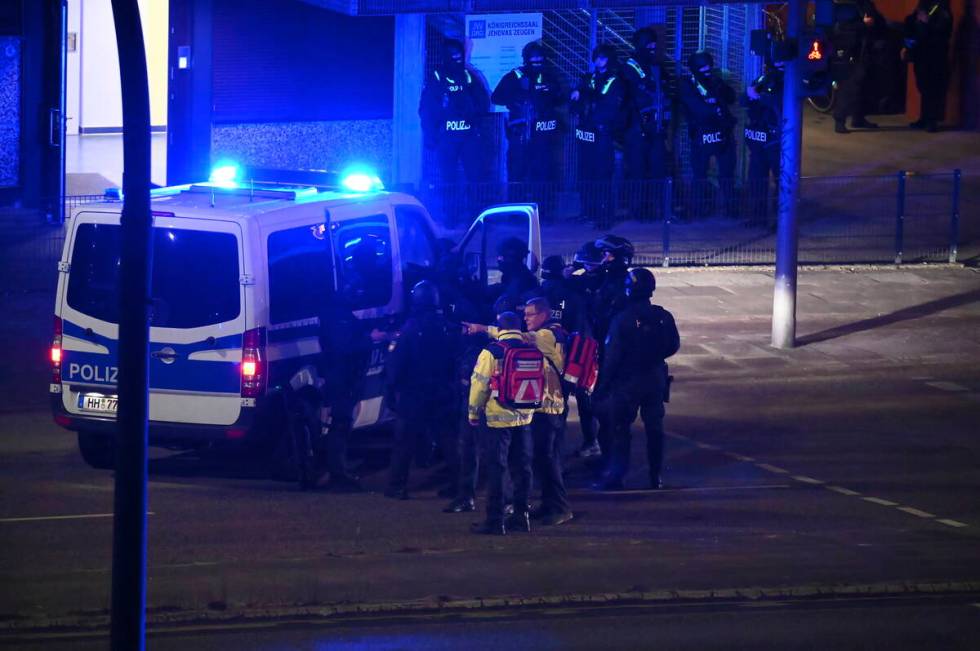 Armed police officers near the scene of a shooting in Hamburg, Germany, on Thursday, March 9, 2 ...