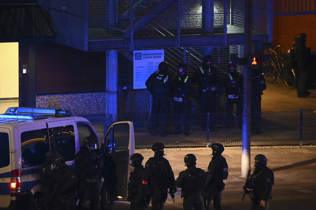 Armed police officers near the scene of a shooting in Hamburg, Germany, on Thursday, March 9, 2 ...