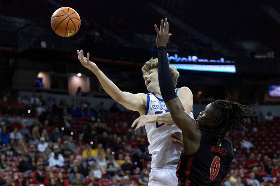 Boise State Broncos center Lukas Milner (25) and UNLV Rebels forward Victor Iwuakor (0) jump fo ...