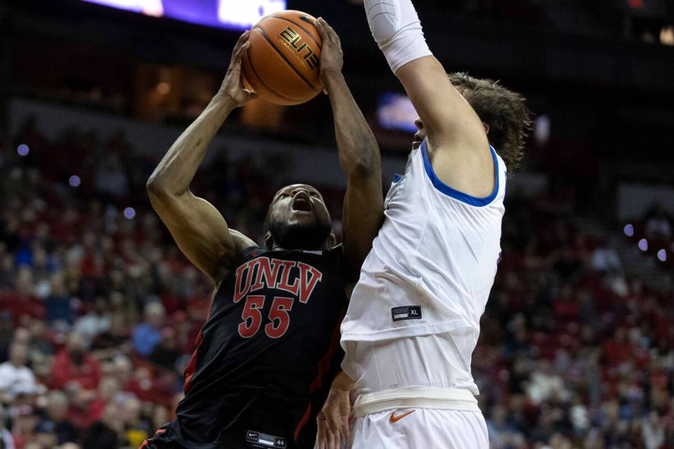 UNLV Rebels guard EJ Harkless (55) shoots against Boise State Broncos forward Tyson Degenhart ( ...