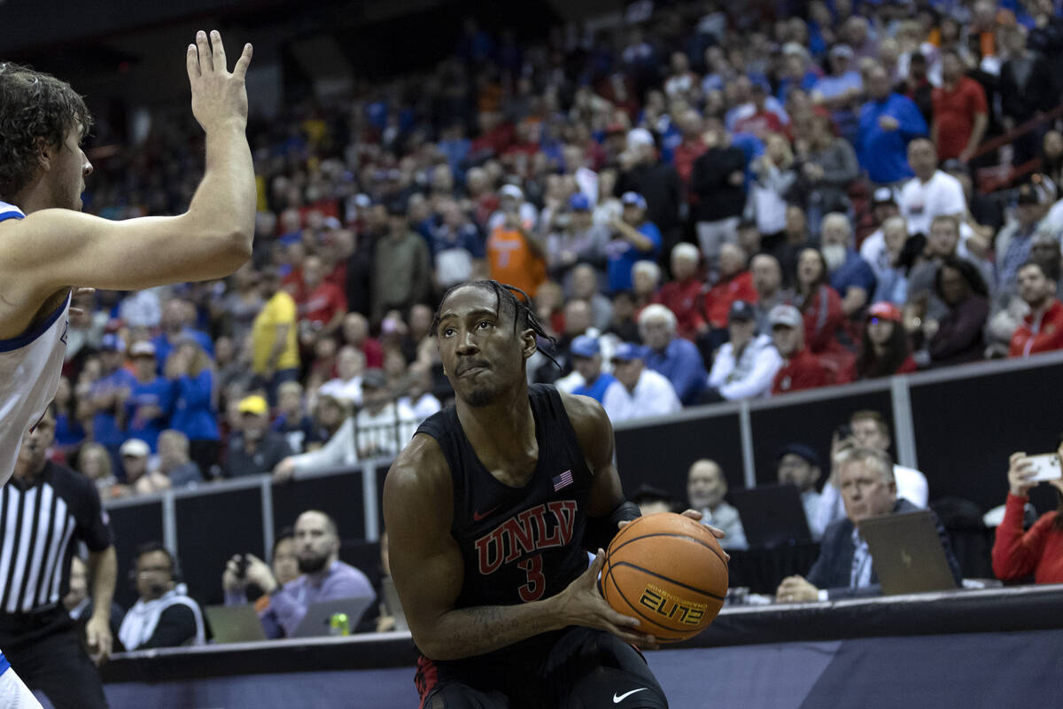 UNLV Rebels guard Shane Nowell (3) moves to shoot a three-pointer against Boise State Broncos f ...