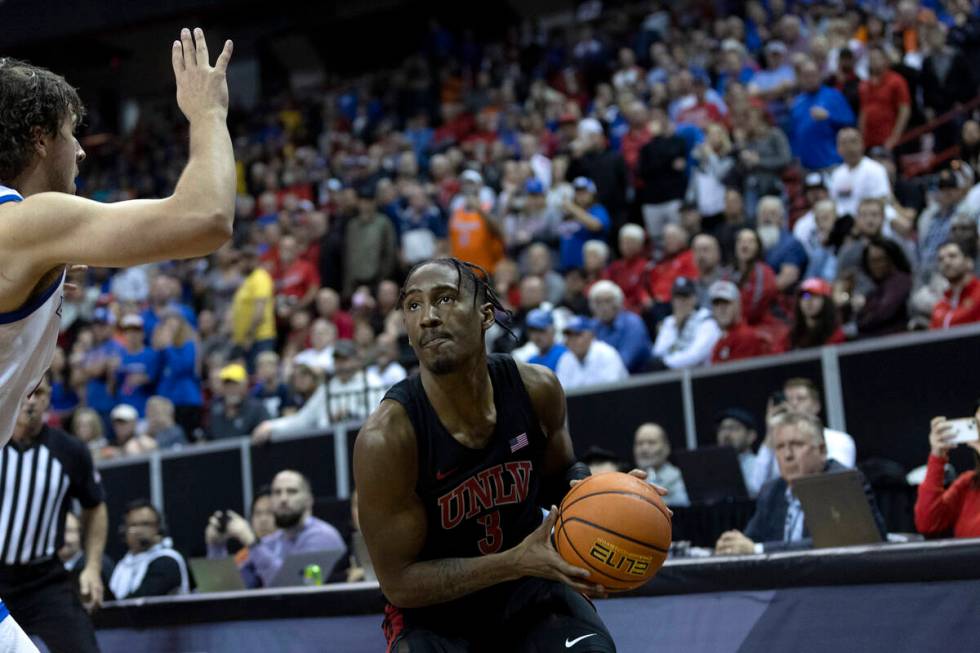 UNLV Rebels guard Shane Nowell (3) moves to shoot a three-pointer against Boise State Broncos f ...