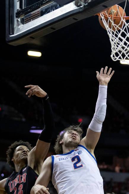 UNLV Rebels center David Muoka (12) and Boise State Broncos forward Tyson Degenhart (2) jump fo ...