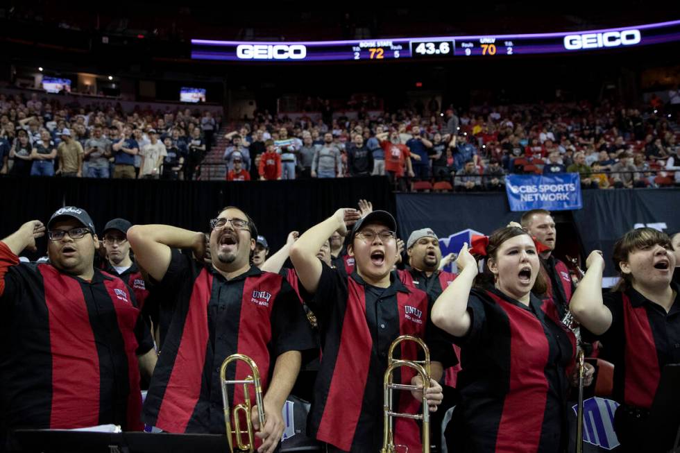 The UNLV Rebels pep band cheers on their team as they chip away at the score during the second ...