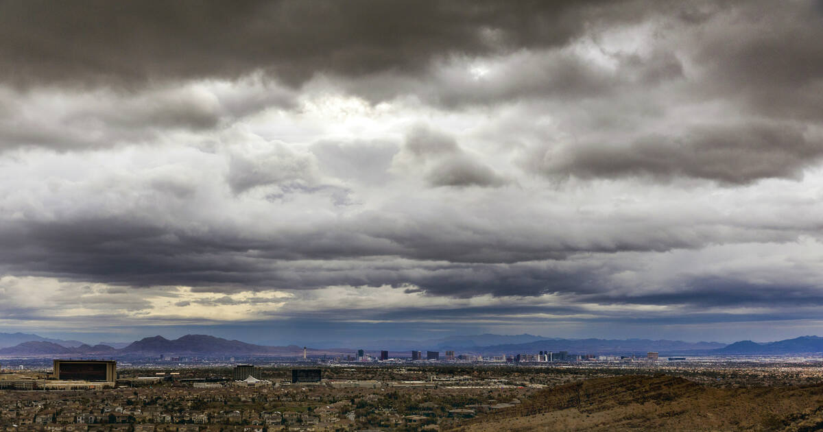 The sun attempts to break through on a rainy sunrise over the Las Vegas Strip as daylight savin ...