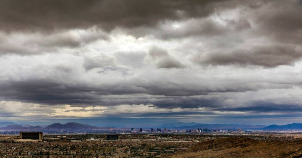 The sun attempts to break through on a rainy sunrise over the Las Vegas Strip as daylight savin ...