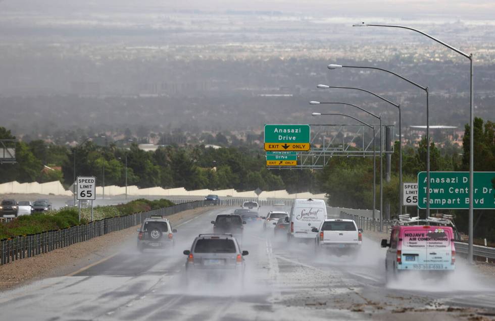 Vehicles travel on Summerlin Parkway as rain comes down over the Las Vegas Valley on July 26, 2 ...