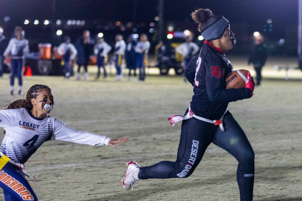 Desert Oasis' Devon Patmon (32) scores over Legacy's Jalyssa Graves (4) during the first half o ...