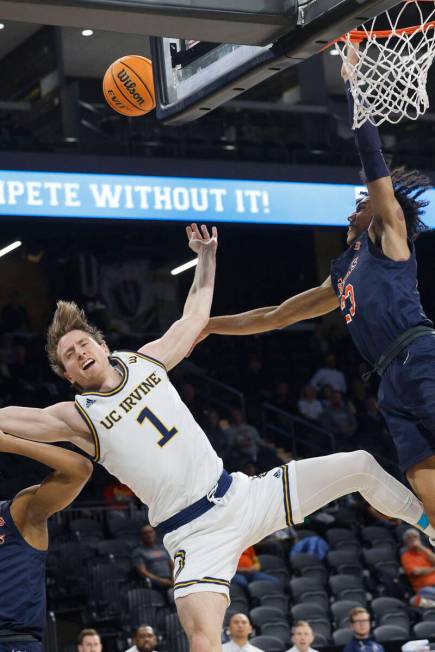 UC Irvine Anteaters guard Dawson Baker (1) loses his balance after attempting a jump shot as Ca ...