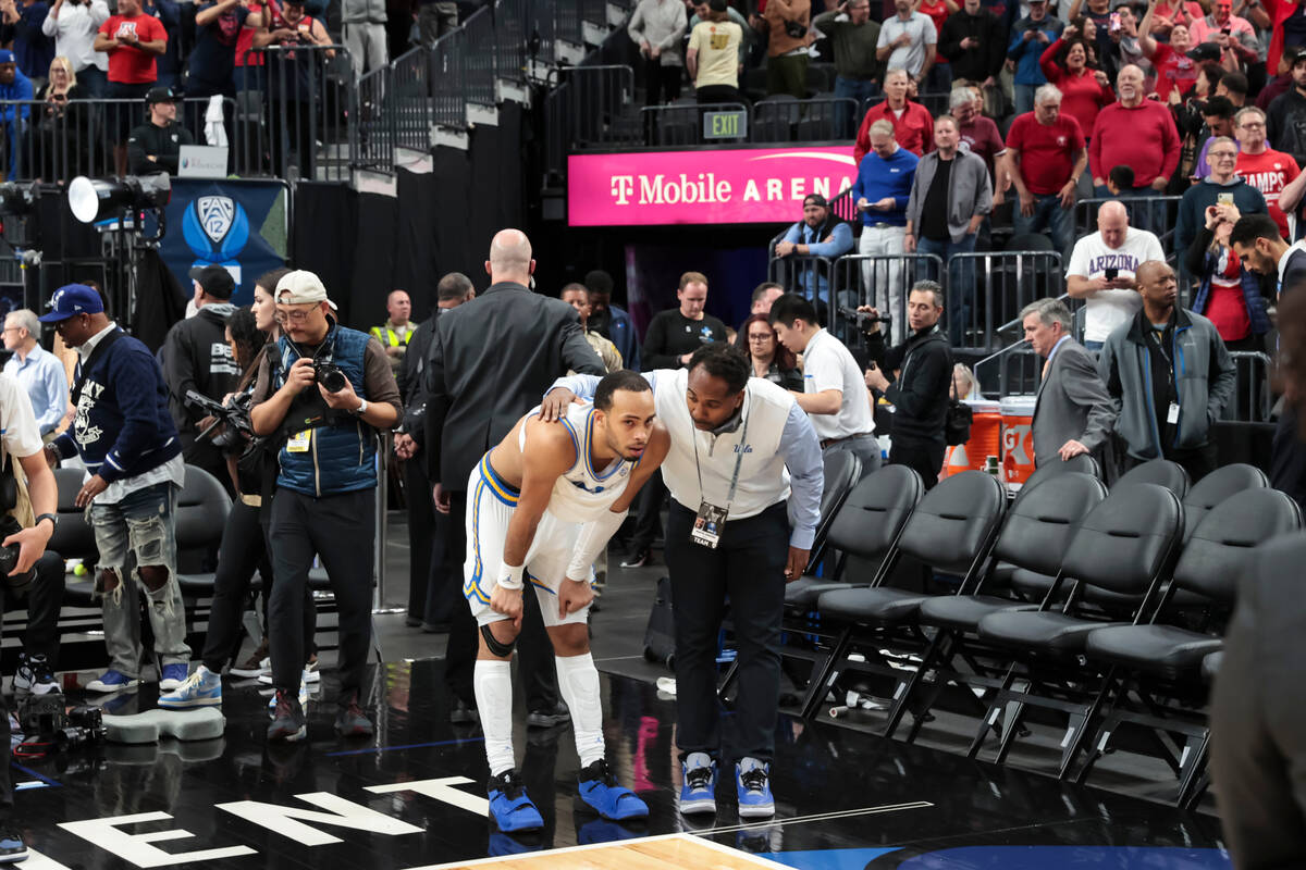 UCLA guard Amari Bailey pauses after the team's loss to Arizona in an NCAA college basketball g ...