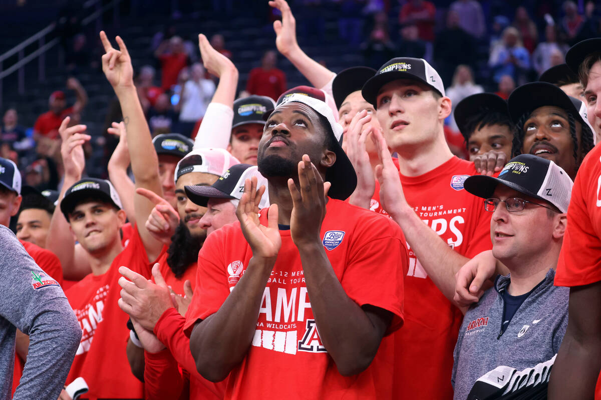 Arizona guard Courtney Ramey, center, celebrates alongside teammates after their win over UCLA ...