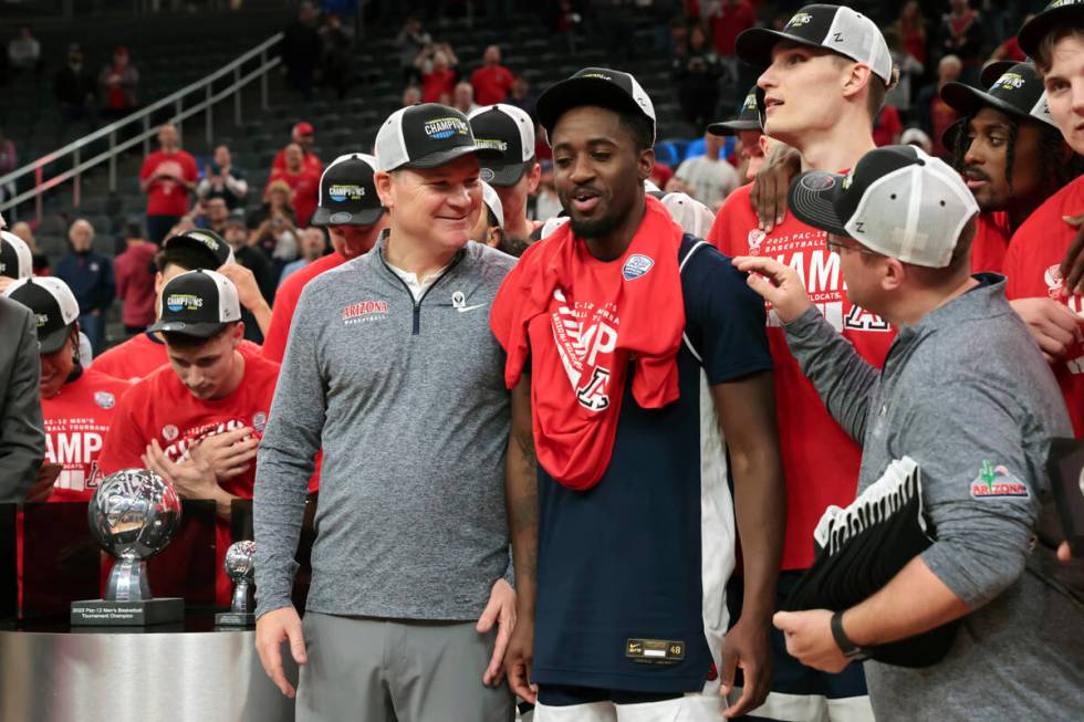 Arizona head coach Tommy Lloyd celebrates with Arizona guard Courtney Ramey after defeating UCL ...