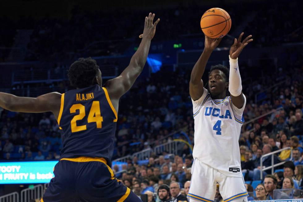 UCLA guard Will McClendon (4) shoots the ball against California forward Sam Alajiki (24) durin ...