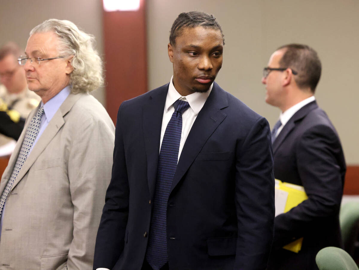 Former Raiders player Henry Ruggs with his attorneys David Chesnoff, left, and Richard Schonfel ...