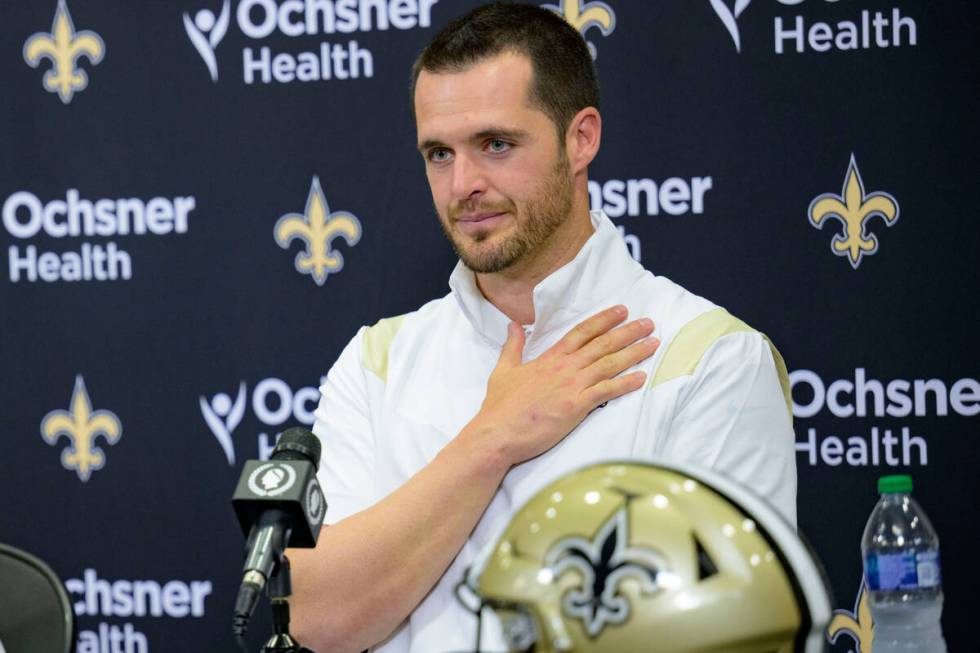 Derek Carr holds his chest in gratitude as he is introduced as the new quarterback of the New O ...