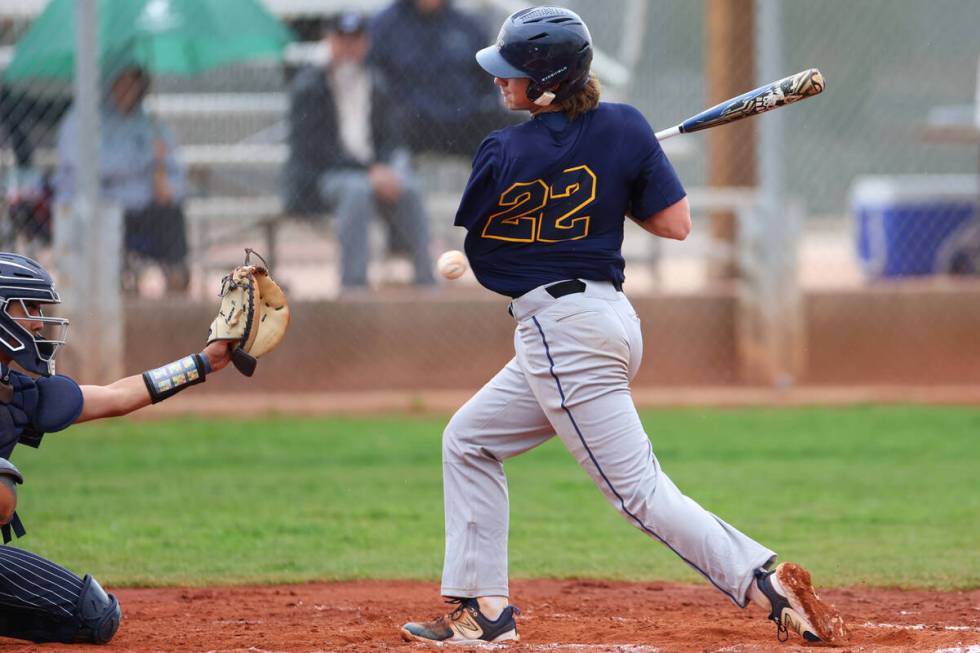 Boulder City's Kanon Welbourne (22) gets hits by the ball to advance to first base during a spr ...