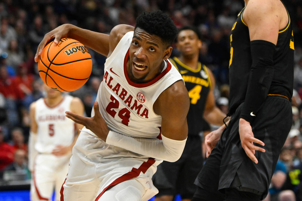 Alabama forward Brandon Miller drives into the lane during the second half of an NCAA college b ...