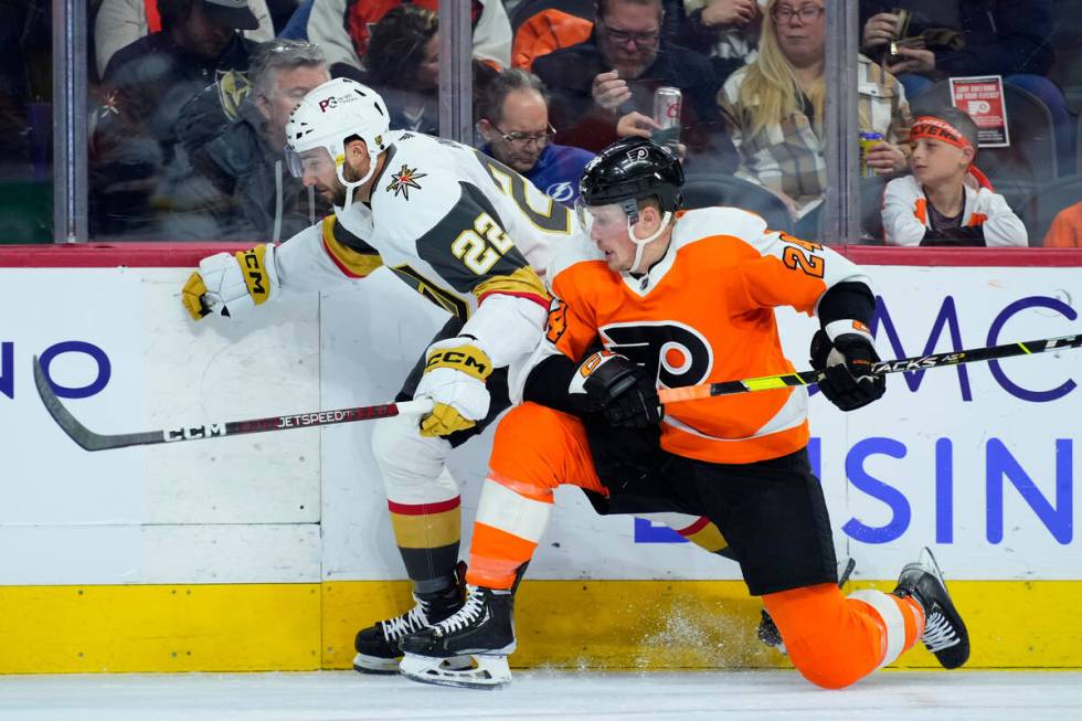 Vegas Golden Knights' Michael Amadio, left, and Philadelphia Flyers' Nick Seeler collide during ...