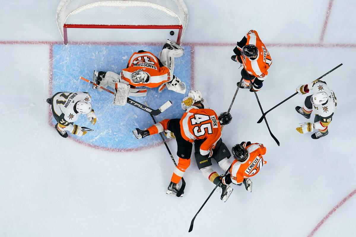 Vegas Golden Knights' Pavel Dorofeyev (16) scores a goal against Philadelphia Flyers' Carter Ha ...