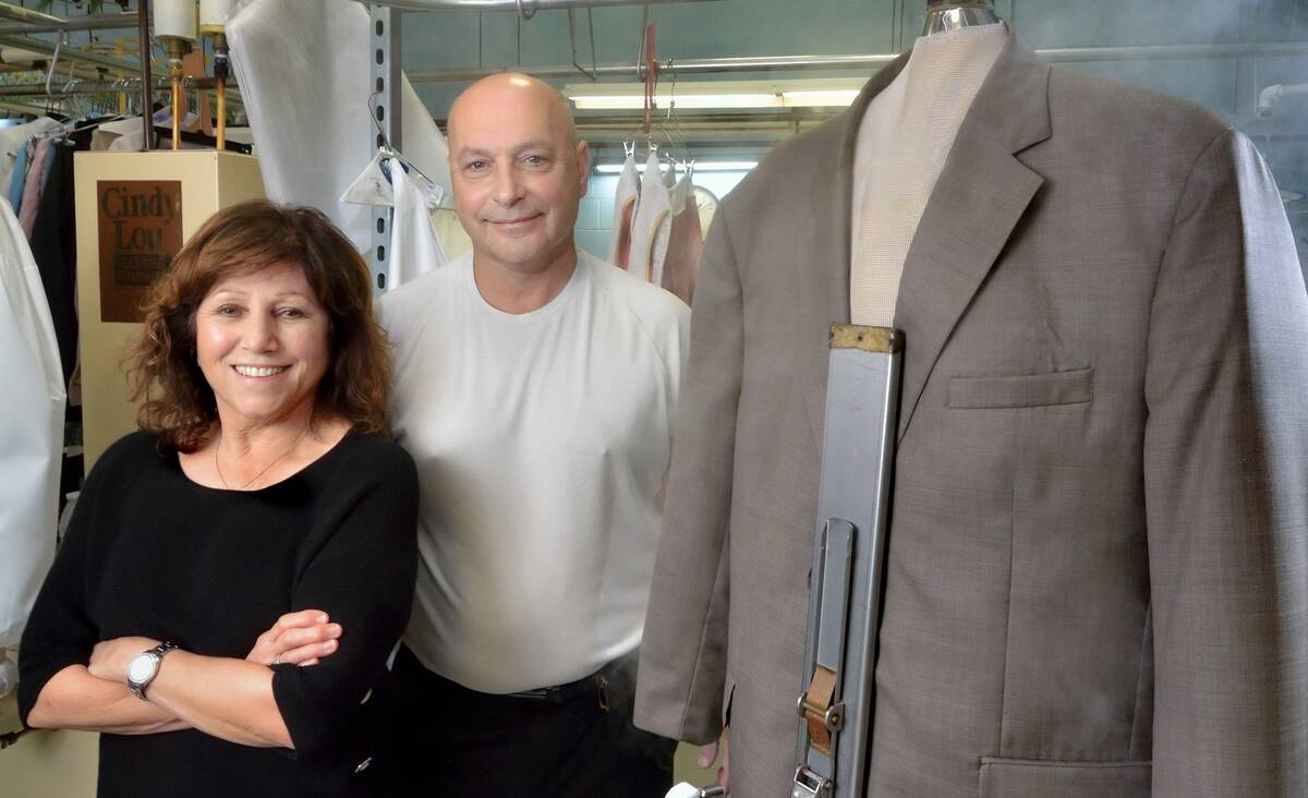 Dan and Judy Del Rossi, owners of Tiffany Couture Cleaners, are seen in the cleaning and pressi ...