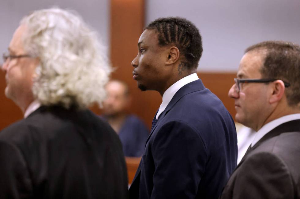 Former Raiders player Henry Ruggs, center, appears in court with his attorneys, David Chesnoff, ...