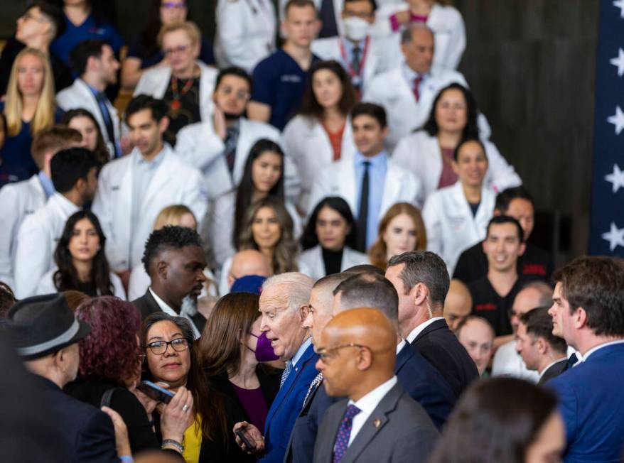 President Joe Biden greets attendees after talking about lowering prescription drug costs durin ...