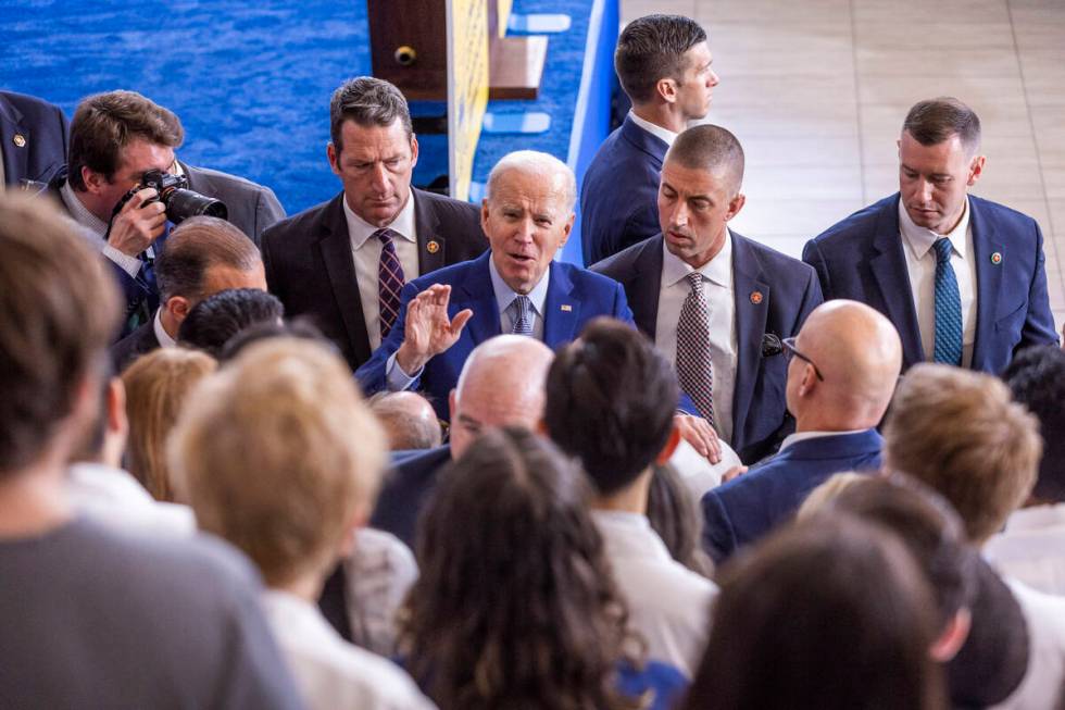 President Joe Biden talks with UNLV medical staff and students after speaking about lowering pr ...