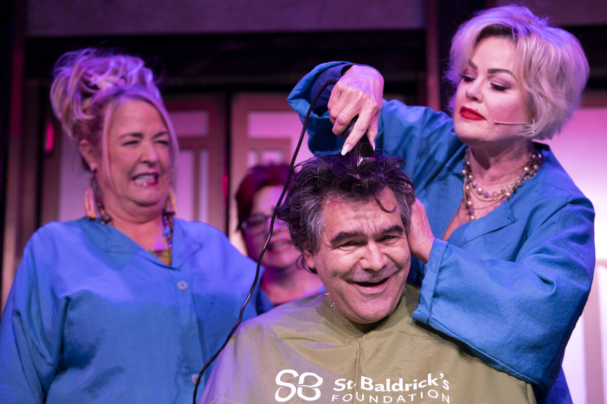 Jacquelyn Holland-Wright, right, a cast member of Menopause The Musical, shaves Review-Journal ...