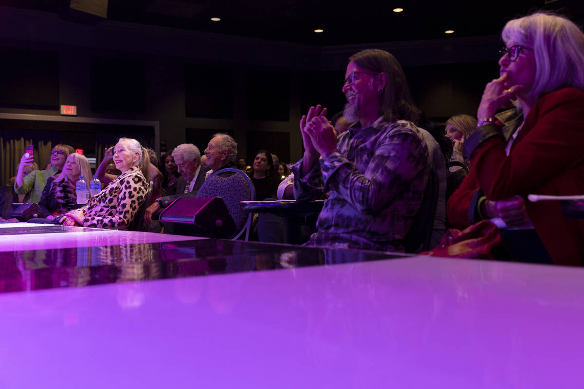 Audience members watch as Review-Journal columnist John Katsilometes has his head shaved to sup ...