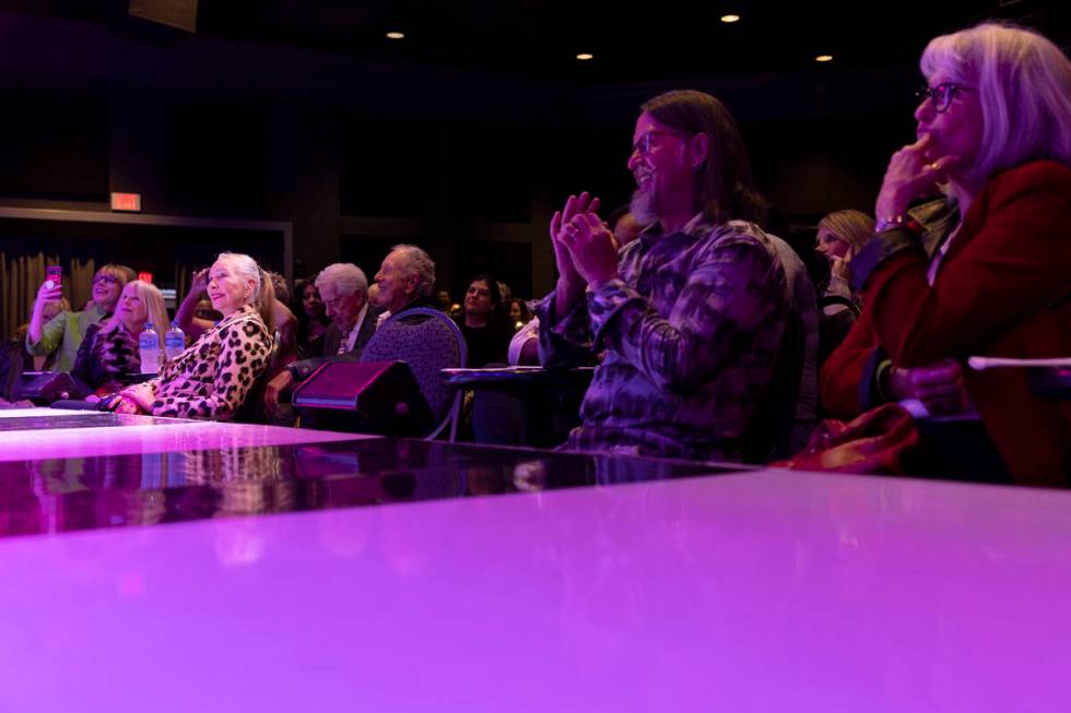 Audience members watch as Review-Journal columnist John Katsilometes has his head shaved to sup ...