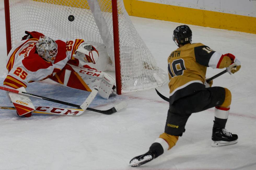 Vegas Golden Knights right wing Reilly Smith (19) scores a goal against Calgary Flames goaltend ...