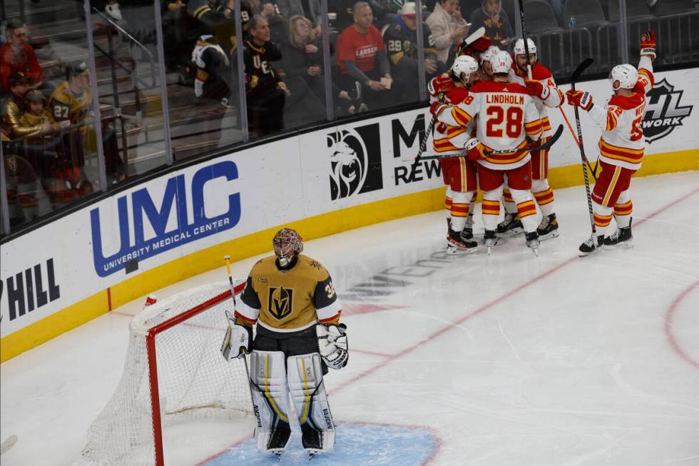 Vegas Golden Knights goaltender Jonathan Quick (32) react after Calgary Flames right wing Tyler ...