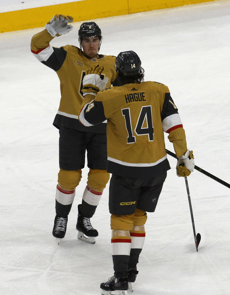 Vegas Golden Knights defenseman Zach Whitecloud (2) receives a high-five from Vegas Golden Knig ...