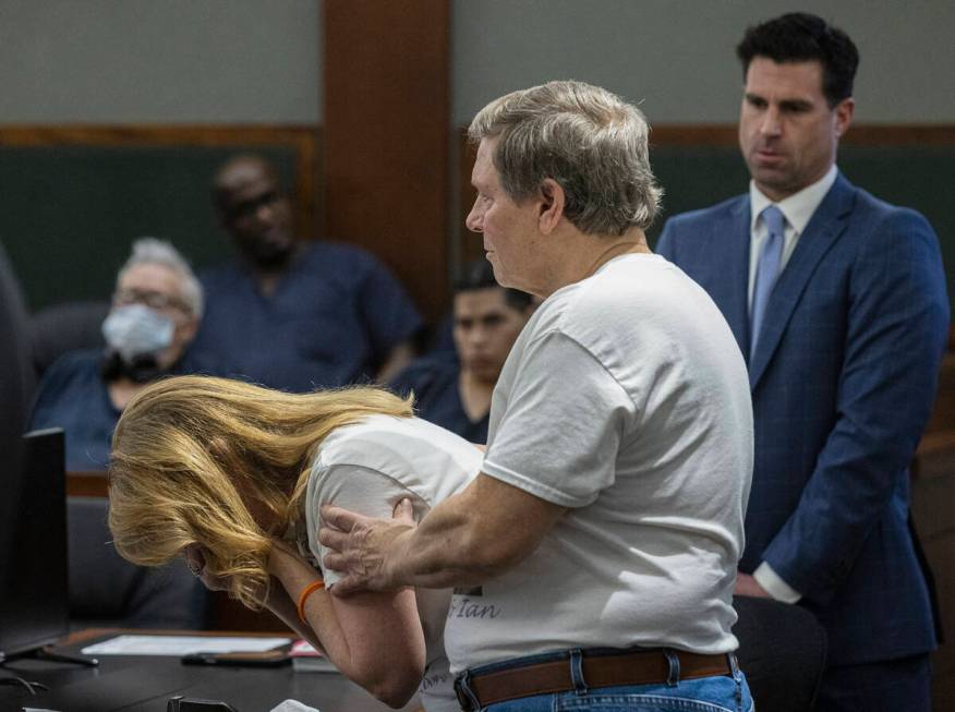 Cindy Peters is comforted by her husband Mark, parent of Rebekah Peters, a murder victim, as sh ...