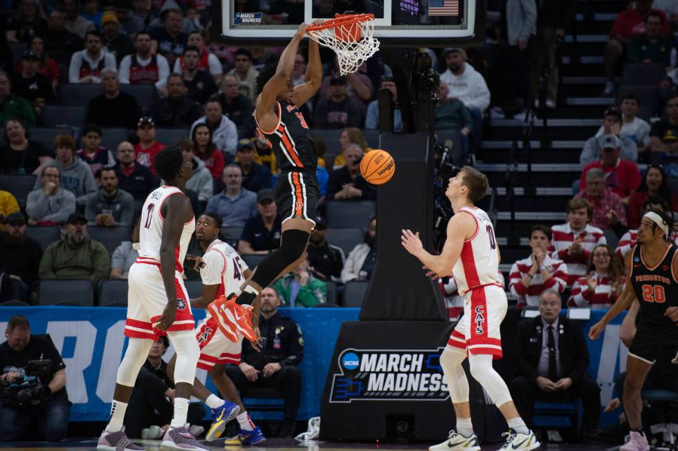 Princeton forward Keeshawn Kellman (32) dunks during the first half of a first-round college ba ...