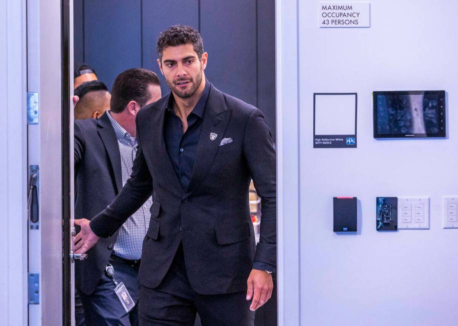 Jimmy Garoppolo enters the room for a press conference at the Raiders Headquarters and Intermou ...