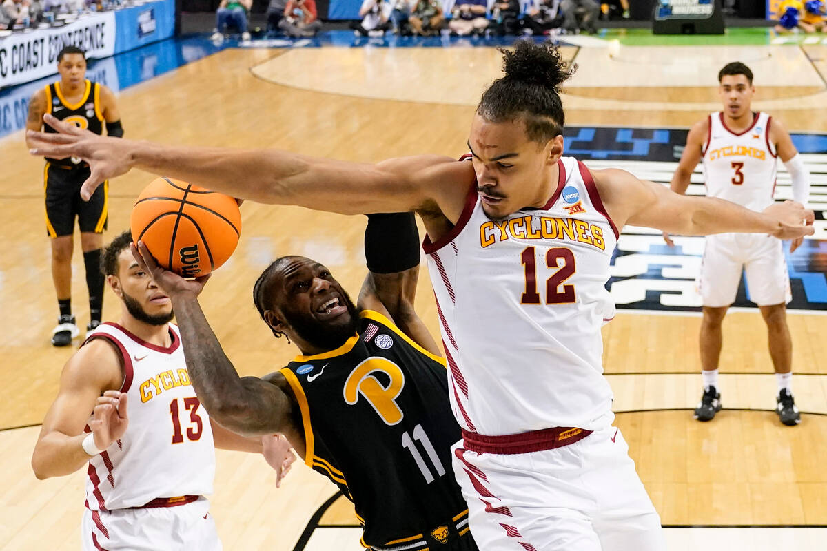 Iowa State forward Robert Jones blocks a shot by Pittsburgh guard Jamarius Burton during the fi ...