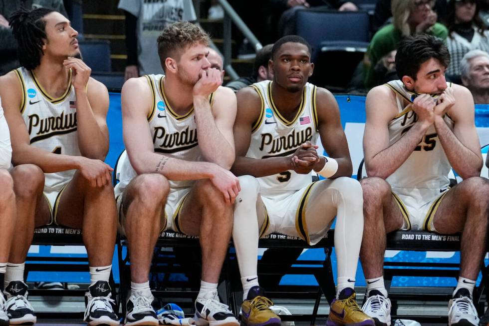 Purdue players, left to right, Trey Kaufman-Renn, Caleb Furst, Brandon Newman and guard Ethan M ...