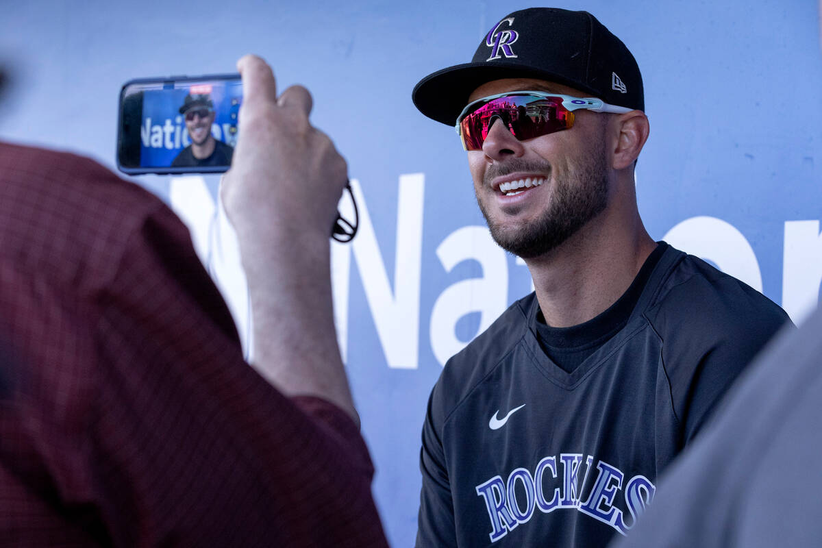 Kris Bryant of the Colorado Rockies speaks to the press before an MLB exhibition game between t ...