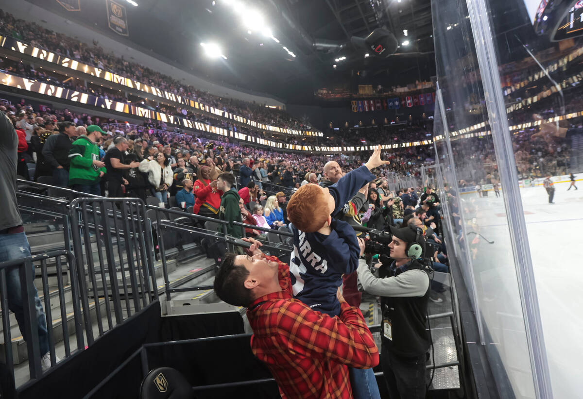 Golden Knights fans throw hats onto the ice after center Jack Eichel, not pictured, landed a ha ...