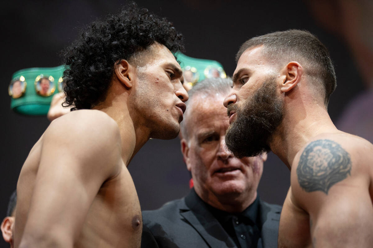 David Benavidez, left, and Caleb Plant, face off during a weigh-in event in advance of their su ...